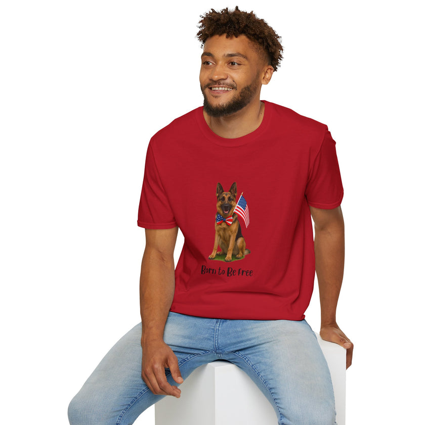 Cherry Red t-shirt featuring a patriotic German Shepherd wearing an American flag bowtie and holding U.S. flags, with the phrase "Born to Be Free" printed below — perfect for dog lovers and patriotic Americans.