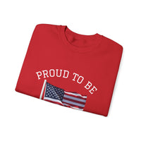 Folded red shirt with 'PROUD TO BE' text and American flag on a white background