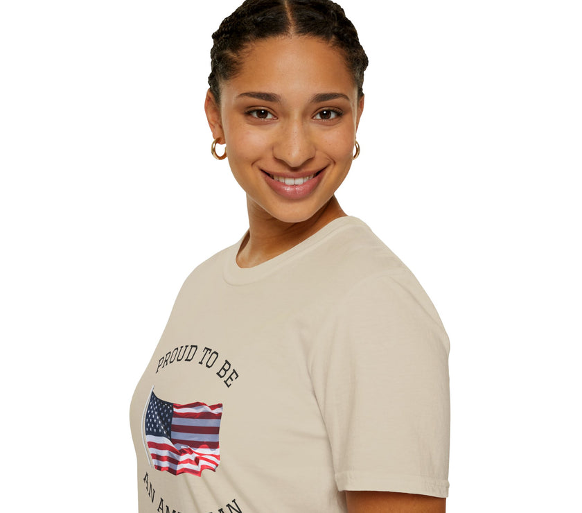 Smiling woman  wearing a white t-shirt with an American flag graphic and the words 'Proud to Be an American' printed around the flag