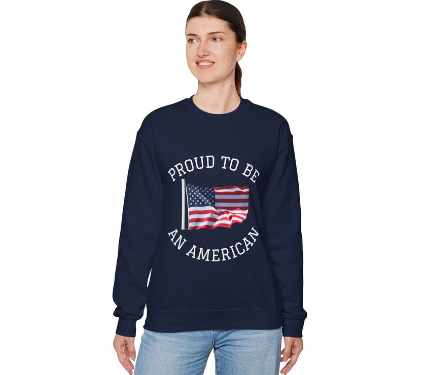 Person wearing a navy sweatshirt with 'Proud to be an American' text and flag design on a white background