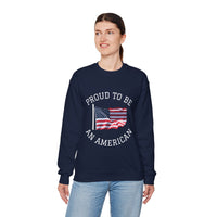 Person wearing a navy sweatshirt with 'Proud to be an American' text and flag design on a white background