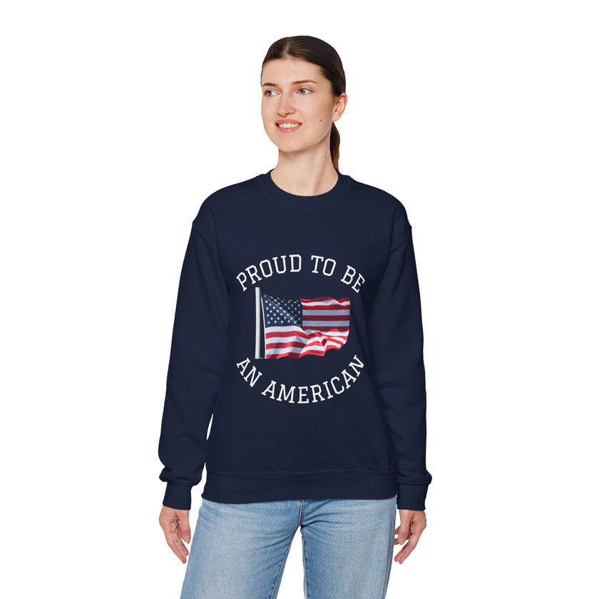 Person wearing a navy sweatshirt with 'Proud to be an American' text and flag design on a white background