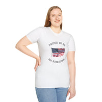 Smiling woman wearing a white t-shirt with an American flag graphic and the words 'Proud to Be an American' printed around the flag