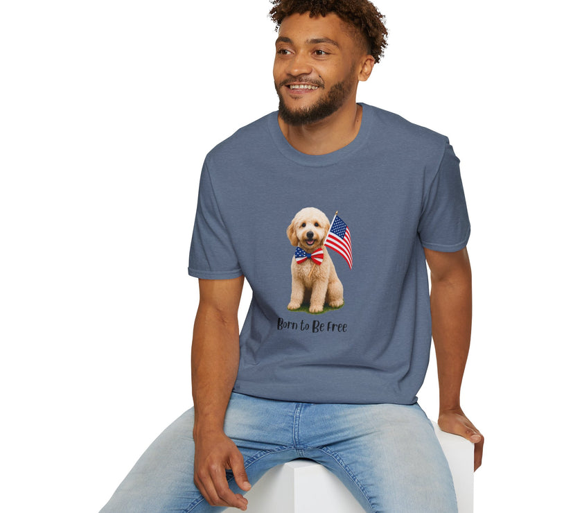 Male wearing T-shirt featuring a cute golden doodle puppy wearing an American flag bow tie and holding a small U.S. flag, with the phrase 'Born to Be Free' printed below the image.