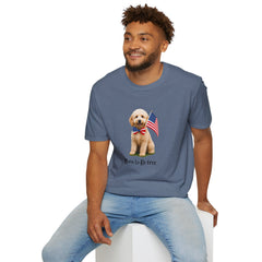 Male wearing T-shirt featuring a cute golden doodle puppy wearing an American flag bow tie and holding a small U.S. flag, with the phrase 'Born to Be Free' printed below the image.