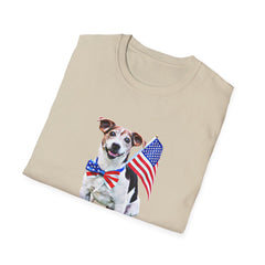 Folded T-shirt featuring a cute  puppy wearing an American flag bow tie and holding a small U.S. flag, with the phrase 'Born to Be Free' printed below the image.