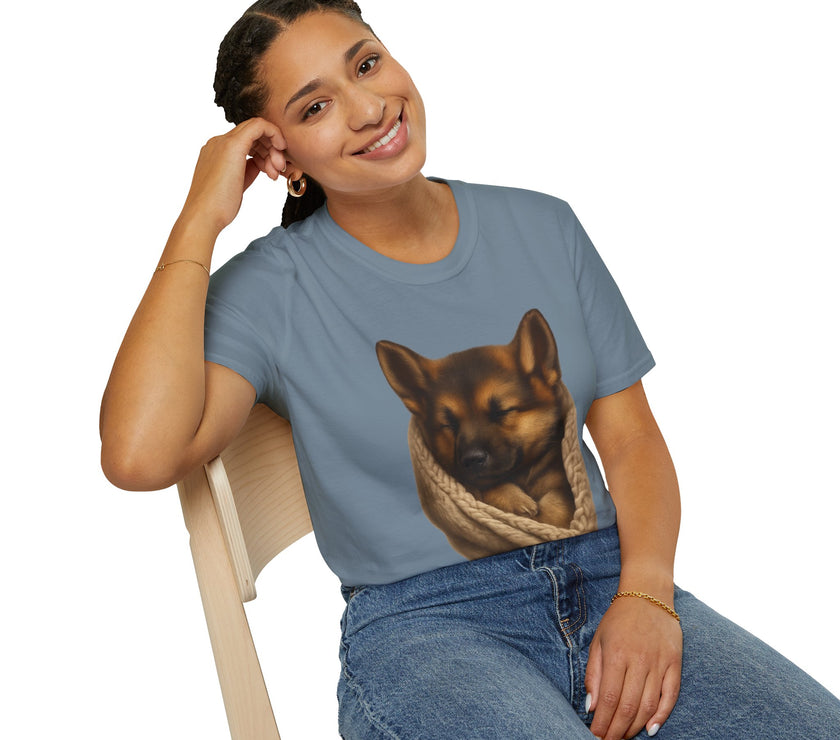 Person wearing a blue t-shirt with a dog graphic, sitting on a white background