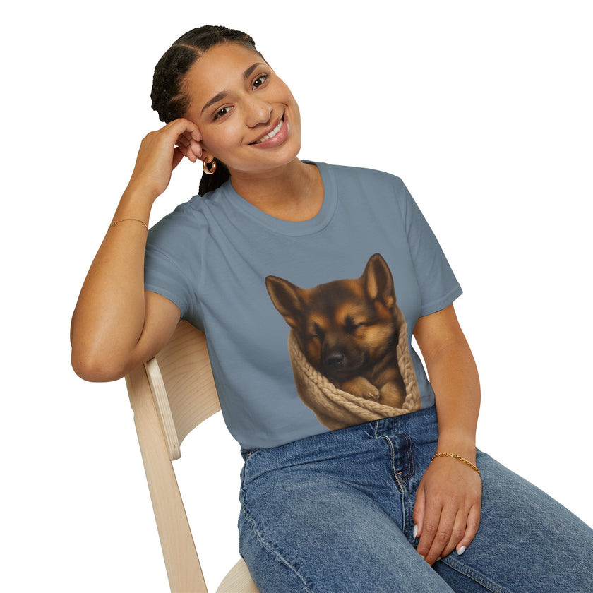 Person wearing a blue t-shirt with a dog graphic, sitting on a white background