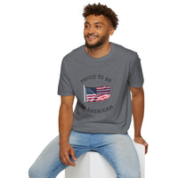 Young man  wearing a white t-shirt with an American flag graphic and the words 'Proud to Be an American' printed around the flag