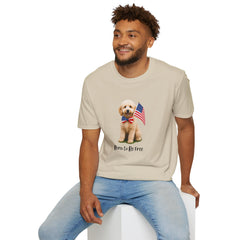 Male wearing T-shirt featuring a cute golden doodle puppy wearing an American flag bow tie and holding a small U.S. flag, with the phrase 'Born to Be Free' printed below the image.