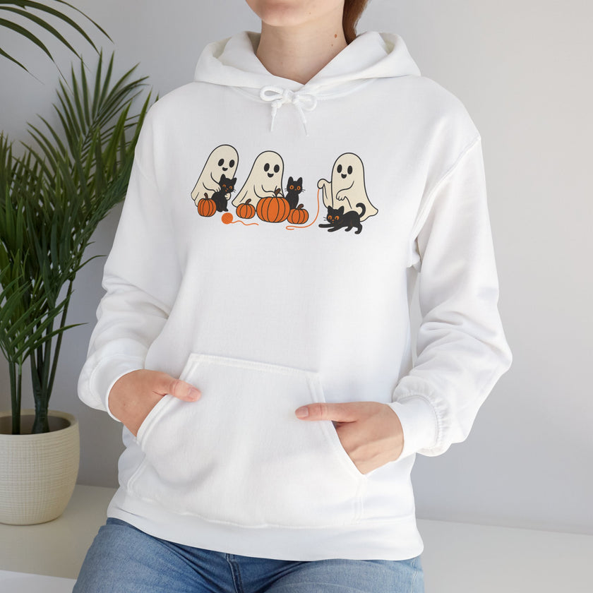 White hoodie with Halloween-themed design featuring ghosts, cats, and pumpkins on a plain background.