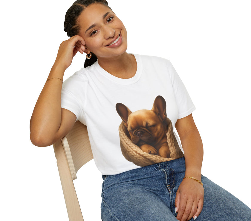 Person wearing a white t-shirt with a dog graphic, sitting on a chair against a white background