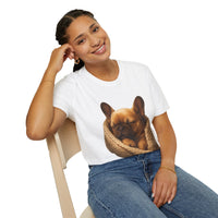 Person wearing a white t-shirt with a dog graphic, sitting on a chair against a white background