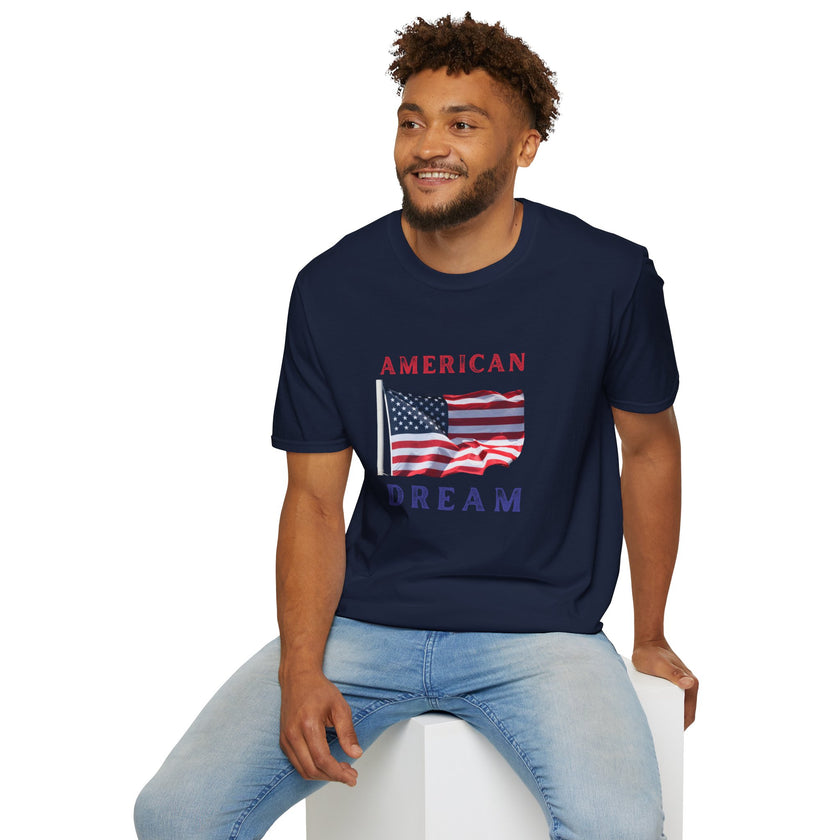 Male wearing T-shirt featuring an American flag graphic with the words 'AMERICAN DREAM' in red and blue text above and below the flag