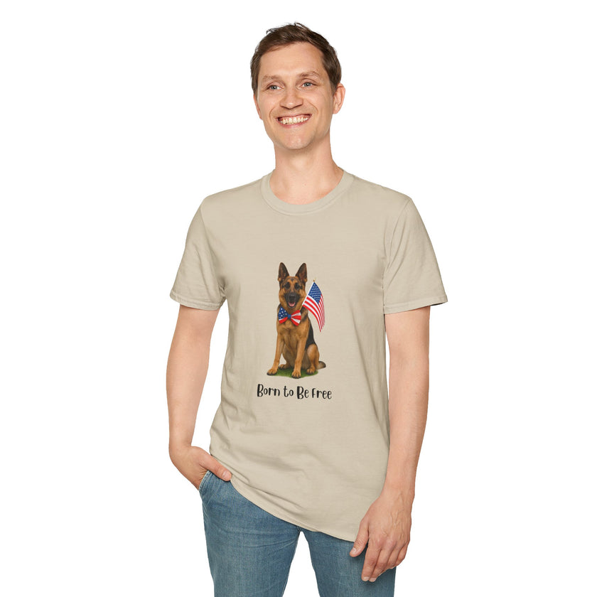 Beige t-shirt featuring a patriotic German Shepherd wearing an American flag bowtie and holding U.S. flags, with the phrase "Born to Be Free" printed below — perfect for dog lovers and patriotic Americans.
