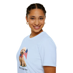 Female wearing T-shirt featuring a cute golden doodle puppy wearing an American flag bow tie and holding a small U.S. flag, with the phrase 'Born to Be Free' printed below the image.