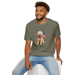 Male wearing T-shirt featuring a cute golden doodle puppy wearing an American flag bow tie and holding a small U.S. flag, with the phrase 'Born to Be Free' printed below the image.