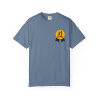 Jean color t-shirt featuring a yellow and navy blue award ribbon graphic on the chest with the text "#1 Dad," designed as a fun and heartfelt Father's Day gift.