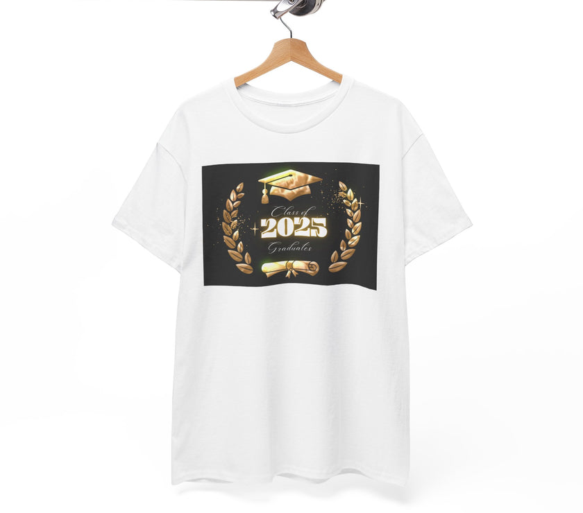 Light gray or white unisex T-shirt featuring a bold "Class of 2025 Graduates" design in gold, with a graduation cap, laurel wreath, and diploma printed on the front. T-shirt is on hanger