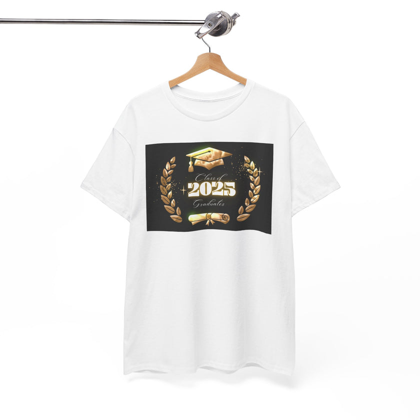 Light gray or white unisex T-shirt featuring a bold "Class of 2025 Graduates" design in gold, with a graduation cap, laurel wreath, and diploma printed on the front. T-shirt is on hanger