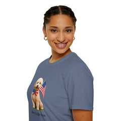 Female wearing T-shirt featuring a cute golden doodle puppy wearing an American flag bow tie and holding a small U.S. flag, with the phrase 'Born to Be Free' printed below the image.