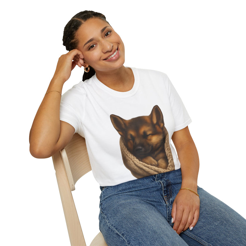 Person wearing a white t-shirt with a dog graphic, sitting on a chair against a white background