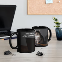 Black ceramic mug featuring a cartoon-style image of a cat sitting at a computer with the funny quote “I work hard so my cat can have a better life.”