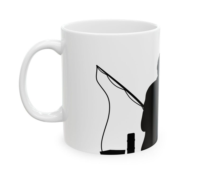 White ceramic mug featuring a silhouette of a child holding a fishing rod next to an adult figure, with the words "Happy Father's Day" in gold script above—an ideal gift for dads who love fishing and family time.