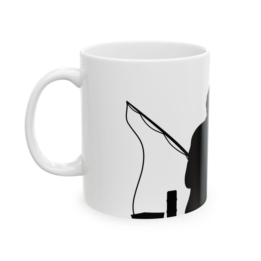 White ceramic mug featuring a silhouette of a child holding a fishing rod next to an adult figure, with the words "Happy Father's Day" in gold script above—an ideal gift for dads who love fishing and family time.