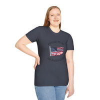 Smiling woman  wearing a white t-shirt with an American flag graphic and the words 'Proud to Be an American' printed around the flag
