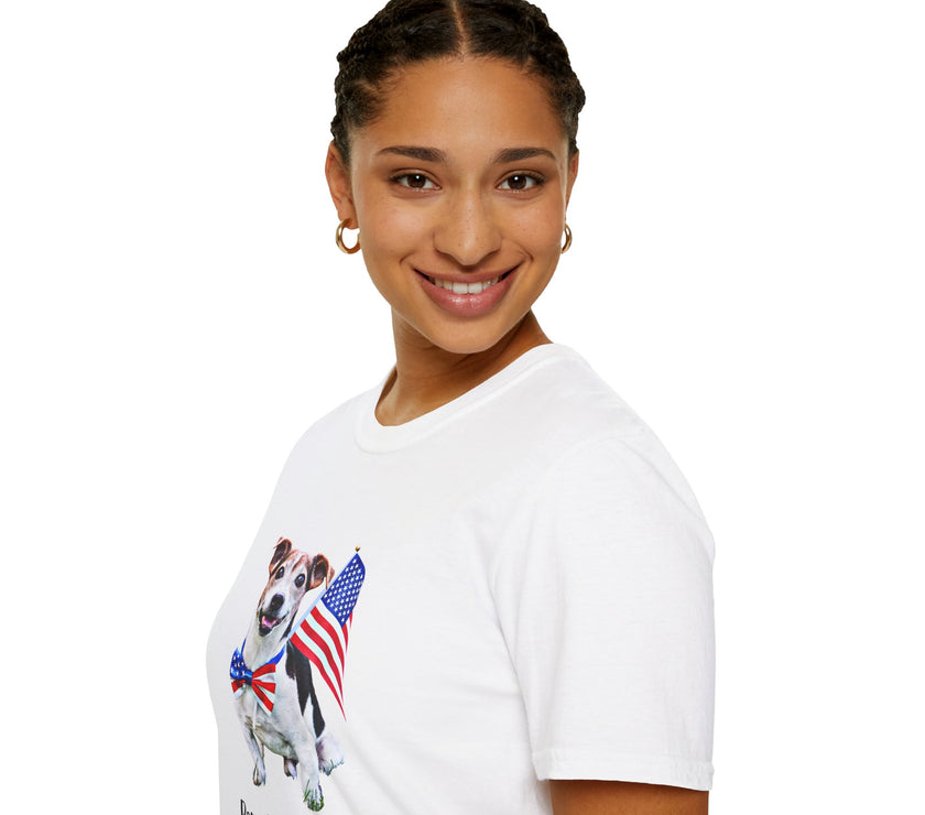 Female wearing T-shirt featuring a cute  puppy wearing an American flag bow tie and holding a small U.S. flag, with the phrase 'Born to Be Free' printed below the image.