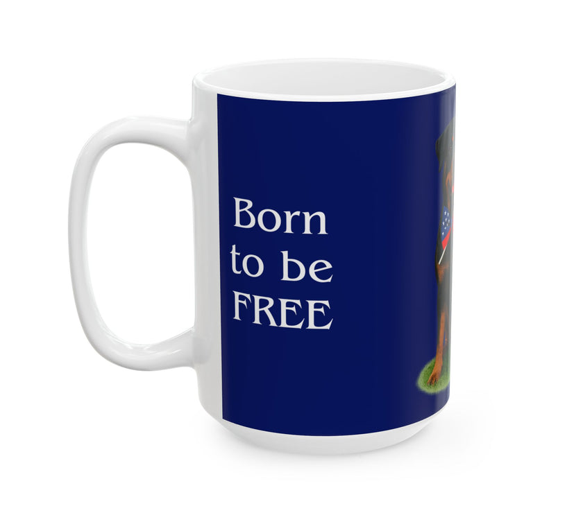 A ceramic mug featuring a Rottweiler sitting on grass, wearing a red, white, and blue bow tie, and holding an American flag against a dark blue background. with the message "Born to be Free"