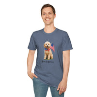 Male wearing T-shirt featuring a cute golden doodle puppy wearing an American flag bow tie and holding a small U.S. flag, with the phrase 'Born to Be Free' printed below the image.