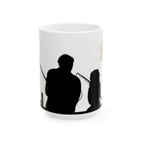 White ceramic mug featuring a silhouette of a child holding a fishing rod next to an adult figure, with the words "Happy Father's Day" in gold script above—an ideal gift for dads who love fishing and family time.