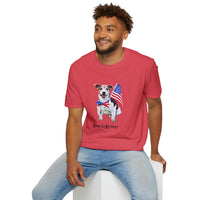 Male wearing T-shirt featuring a cute golden doodle puppy wearing an American flag bow tie and holding a small U.S. flag, with the phrase 'Born to Be Free' printed below the image.