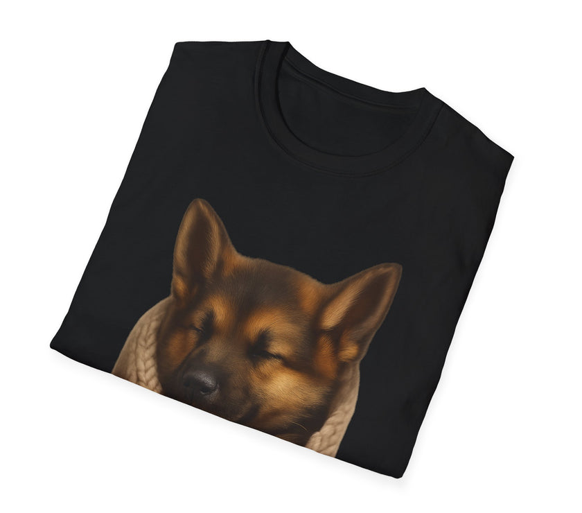 Black t-shirt with a dog's face printed on it, folded on a white background
