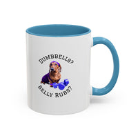 Two tone ceramic mug featuring a dachshund next to dumbbells and the humorous text 'Dumbbells? Belly Rubs?', designed for dog lovers and fitness enthusiasts.