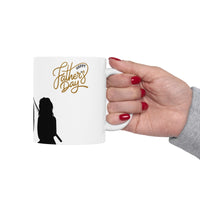 White ceramic mug featuring a silhouette of a child holding a fishing rod next to an adult figure, with the words "Happy Father's Day" in gold script above—an ideal gift for dads who love fishing and family time.
