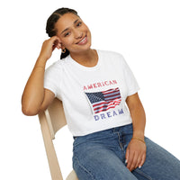 Female wearing T-shirt featuring an American flag graphic with the words 'AMERICAN DREAM' in red and blue text above and below the flag