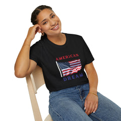 Female wearing T-shirt featuring an American flag graphic with the words 'AMERICAN DREAM' in red and blue text above and below the flag
