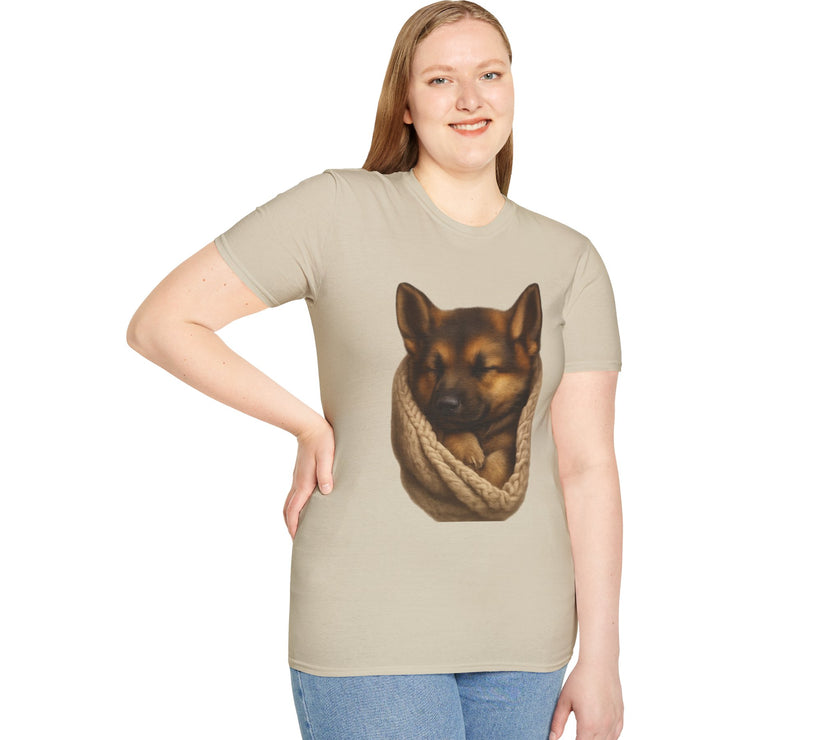 Person wearing a beige t-shirt with a graphic of a dog in a sling on a white background