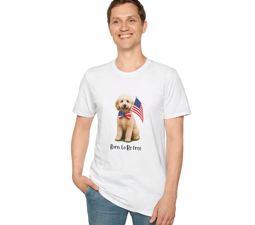 Male wearing T-shirt featuring a cute golden doodle puppy wearing an American flag bow tie and holding a small U.S. flag, with the phrase 'Born to Be Free' printed below the image.