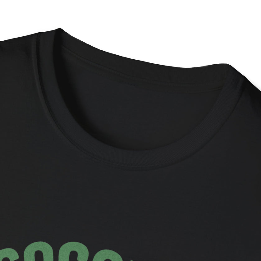 Close-up of a black t-shirt with green text on a white background