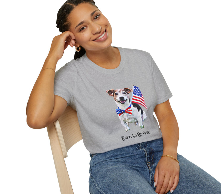 Female wearing T-shirt featuring a cute  puppy wearing an American flag bow tie and holding a small U.S. flag, with the phrase 'Born to Be Free' printed below the image.