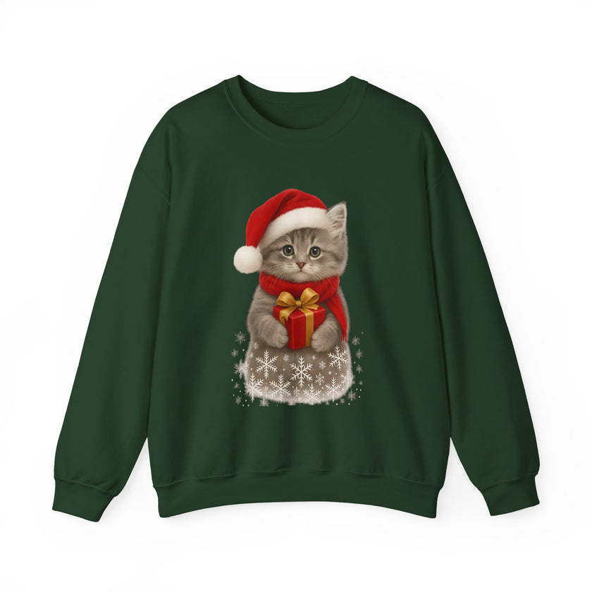 Green sweatshirt featuring a gray kitten wearing a Santa hat and red scarf, holding a small red gift box with a gold bow, surrounded by snowflake designs.