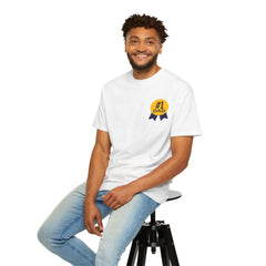 White t-shirt featuring a yellow and navy blue award ribbon graphic on the chest with the text "#1 Dad," designed as a fun and heartfelt Father's Day gift.