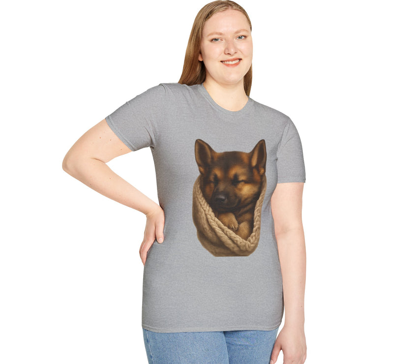 Person wearing a gray t-shirt with a graphic of a dog in a rope bag on a white background
