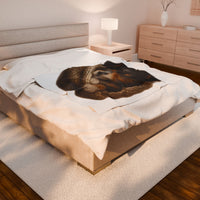 Blanket with Puppy wrapped in a knitted blanket on a white 