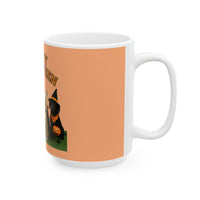 White mug with a Halloween-themed design featuring a dog in a witch hat and pumpkin on an orange background.