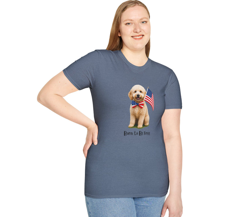 Female wearing T-shirt featuring a cute golden doodle puppy wearing an American flag bow tie and holding a small U.S. flag, with the phrase 'Born to Be Free' printed below the image.